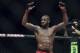 Apr 26, 2014; Baltimore, MD, USA; Jon Jones puts his arms in the air after the UFC light heavy weight championship fight against Glover Texeira at Baltimore Arena. Jones retained the light heavy height championship by defeating Teixeria. Mandatory Cre