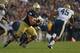 SOUTH BEND, IN - NOVEMBER 03: Zack Martin #70 of the Notre Dame Fighting Irish moves to block Shayne Hale #45 of the Pittsburgh Panthers at Notre Dame Stadium on November 3, 2012 in South Bend, Indiana. Notre Dame defeated Pittsburgh 29-26 in triple over