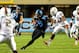 Oct 17, 2013; Chapel Hill, NC, USA; North Carolina Tar Heels tight end Eric Ebron (85) runs for a touchdown as Miami Hurricanes defensive back Deon Bush (2) and linebackers Raphael Kirby (56) and Tyrone Cornileus (31) defend in the first quarter at Kenan