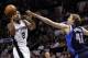 uApr 30, 2014; San Antonio, TX, USA; San Antonio Spurs forward Kawhi Leonard (2) shoots as Dallas Mavericks player Dirk Nowitzki (41) defends in game five of the first round of the 2014 NBA Playoffs at AT&T Center. The Spurs won 109-103. Mandatory Credit: