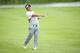 SINGAPORE - MAY 01: Panuphol Pittayarat of Thailand plays his second shot on the 18th hole to shoot 63 on day one of The Championship at Laguna National held at Laguna National Golf & Country Club on May 1, 2014 in Singapore. (Photo by Andrew Redington/