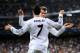 MADRID, SPAIN - MARCH 18: Cristiano Ronaldo of Real Madrid celebrates with teammate Gareth Bale after scoring his team's second goal during the UEFA Champions League Round of 16, second leg match between Real Madrid and FC Schalke 04 at Estadio Santiago