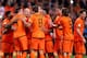 AMSTERDAM, NETHERLANDS - OCTOBER 11: Arjen Robben of Holland (3rd L) celebrates with Robin van Persie (2nd L) during the FIFA 2014 World Cup Qualifing match between Holland and Hungary at Amsterdam Arena on October 11, 2013 in Amsterdam, Netherlands. (P