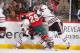 ST. PAUL, MN - JANUARY 23: (L-R) Ben Smith #28 and Brandon Bollig #52 of the Chicago Blackhawks battle with Jason Pominville #29 of the Minnesota Wild for the puck during the game on January 23, 2014 at the Xcel Energy Center in St. Paul, Minnesota. (Phot