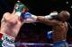 LAS VEGAS, NV - SEPTEMBER 14: (L-R) Floyd Mayweather Jr. and Canelo Alvarez exchange punches during their WBC/WBA 154-pound title fight at the MGM Grand Garden Arena on September 14, 2013 in Las Vegas, Nevada. (Photo by Al Bello/Getty Images)