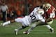 PASADENA, CA - JANUARY 06: Quarterback Jameis Winston #5 of the Florida State Seminoles is sacked by defensive end Dee Ford #30 of the Auburn Tigers during the 2014 Vizio BCS National Championship Game at the Rose Bowl on January 6, 2014 in Pasadena, Cal