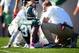 Oct 12, 2013; East Lansing, MI, USA; Michigan State Spartans trainers check on cornerback Darqueze Dennard (31) during the second half in a game at Spartan Stadium. MSU won 42-28. Mandatory Credit: Mike Carter-USA TODAY Sports