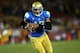LOS ANGELES, CA - NOVEMBER 30: Quarterback Brett Hundley #17 of the UCLA Bruins carries on a 12 yard touchdown run in the third quarter against the USC Trojans at Los Angeles Coliseum on November 30, 2013 in Los Angeles, California. The Bruins won 35-14