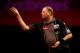 LONDON, ENGLAND - DECEMBER 27: Raymond van Barneveld of Holland in action during his third round match against Mark Webster of Wales on day twelve of the Ladbrokes.com World Darts Championship at Alexandra Palace on December 27, 2013 in London, England.