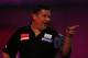 LONDON, ENGLAND - DECEMBER 28: Gary Anderson of Scotland in action during his third round match against Michael van Gerwen of Holland on day thirteen of the Ladbrokes.com World Darts Championship at Alexandra Palace on December 28, 2013 in London, Englan