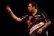 LONDON, ENGLAND - DECEMBER 28: Adrian Lewis of England in action during his third round match against Mervyn King of England on day thirteen of the Ladbrokes.com World Darts Championship at Alexandra Palace on December 28, 2013 in London, England. (Photo