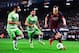 BARCELONA, SPAIN - JANUARY 08: Andres Iniesta of FC Barcelona duels for the ball with Diego Castro (L) and Mehdi Lacen of Getafe CF during the Copa del Rey round of 16 first leg match between FC Barcelona and Getafe CF at Camp Nou on January 8, 2014 in Ba