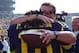 November 17, 2012; Ann Arbor, MI, USA; Michigan Wolverines head coach Brady Hoke hugs Michigan Wolverines quarterback Denard Robinson (16) before the game against the Iowa Hawkeyes at Michigan Stadium. Mandatory Credit: Rick Osentoski-USA TODAY Sports