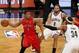 May 2, 2014; Brooklyn, NY, USA; Toronto Raptors guard Kyle Lowry (7) passes defended by Brooklyn Nets forward Paul Pierce (34) and guard Deron Williams (8) during the first half in game six of the first round of the 2014 NBA Playoffs at Barclays Center. M