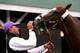 LOUISVILLE, KY - MAY 01: Kentucky Derby contender California Chrome is held by groom Raul Rodriguez after working out on the track during early morning workouts at Churchill Downs on May 1, 2014 in Louisville, Kentucky. (Photo by Kevin C. Cox/Getty Imag