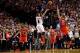 May 2, 2014; Portland, OR, USA; Portland Trail Blazers guard Damian Lillard (0) makes a three pointer at the buzzer over Houston Rockets forward Chandler Parsons (25) to win the game during the fourth quarter in game six of the first round of the 2014 NBA