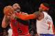 NEW YORK, NY - DECEMBER 21: Carmelo Anthony #7 of the New York Knicks fouls Carlos Boozer #5 of the Chicago Bulls in the second quarter at Madison Square Garden on December 21, 2012 in New York City. NOTE TO USER: User expressly acknowledges and agrees th