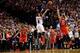 May 2, 2014; Portland, OR, USA; Portland Trail Blazers guard Damian Lillard (0) makes a three pointer at the buzzer over Houston Rockets forward Chandler Parsons (25) to win the game during the fourth quarter in game six of the first round of the 2014 NBA