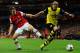 LONDON, ENGLAND - OCTOBER 22: Aaron Ramsey of Arsenal marshalls Marcel Schmelzer of Borussia Dortmund during the UEFA Champions League Group F match between Arsenal and Borussia Dortmund at Emirates Stadium on October 22, 2013 in London, England. (Phot