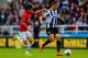 NEWCASTLE UPON TYNE, ENGLAND - APRIL 05: Hatem Ben Arfa of Newcastle United is closed down by Shinji Kagawa of Manchester United during the Barclays Premier League match between Newcastle United and Manchester United at St James' Park on April 5, 2014 in