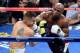 LAS VEGAS, NV - MAY 03: (R-L) Floyd Mayweather Jr. throws a right at Marcos Maidana during their WBC/WBA welterweight unification fight at the MGM Grand Garden Arena on May 3, 2014 in Las Vegas, Nevada. (Photo by Ethan Miller/Getty Images)