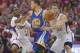 May 3, 2014; Los Angeles, CA, USA; Golden State Warriors guard Stephen Curry (30) is defended by Los Angeles Clippers guard Chris Paul (3) and forward Blake Griffin (32) during game seven of the first round of the 2014 NBA Playoffs at Staples Center. The