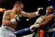 LAS VEGAS, NV - MAY 03: (L-R) Marcos Maidana throws a left at Floyd Mayweather Jr. during their WBC/WBA welterweight unification fight at the MGM Grand Garden Arena on May 3, 2014 in Las Vegas, Nevada. (Photo by Harry How/Getty Images)