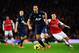 LONDON, ENGLAND - FEBRUARY 12: Rio Ferdinand of Manchester United holds off the challenge of Mesut Ozil of Arsenal challenge for the ball during the Barclays Premier League match between Arsenal and Manchester United at the Emirates Stadium on February 1