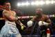 LAS VEGAS, NV - MAY 03: (R-L) Floyd Mayweather Jr. knocks back Marcos Maidana during their WBC/WBA welterweight unification fight at the MGM Grand Garden Arena on May 3, 2014 in Las Vegas, Nevada. (Photo by Harry How/Getty Images)