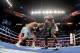 LAS VEGAS, NV - MAY 03: (R-L) Floyd Mayweather Jr. throws a right at Marcos Maidana during their WBC/WBA welterweight unification fight at the MGM Grand Garden Arena on May 3, 2014 in Las Vegas, Nevada. (Photo by Harry How/Getty Images)