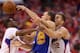 LOS ANGELES, CA - MAY 03: Stephen Curry #30 of the Golden State Warriors tries to pass the ball between Chris Paul #3 and Blake Griffin #32 of the Los Angeles Clippers in Game Seven of the Western Conference Quarterfinals during the 2014 NBA Playoffs at