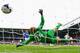 LIVERPOOL, ENGLAND - MAY 03: Edin Dzeko of Manchester City scores his team's second goal past Tim Howard of Everton during the Barclays Premier League match between Everton and Manchester City at Goodison Park on May 3, 2014 in Liverpool, England. (Phot