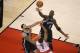 May 4, 2014; Toronto, Ontario, CAN; Toronto Raptors point guard Kyle Lowry (7) shoots against Brooklyn Nets point guard Deron Williams (8) and forward Kevin Garnett (2) in game seven of the first round of the 2014 NBA Playoffs at Air Canada Centre. Mandat