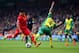 NORWICH, ENGLAND - APRIL 20: Luis Suarez of Liverpool is challenged by Bradley Johnson of Norwich City during the Barclays Premier League match between Norwich City and Liverpool at Carrow Road on April 20, 2014 in Norwich, England. (Photo by Jamie McDo