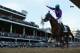 LOUISVILLE, KY - MAY 03: Jockey Victor Espinoza celebrates atop of California Chrome #5 after crossing the finish line to win the 140th running of the Kentucky Derby at Churchill Downs on May 3, 2014 in Louisville, Kentucky. (Photo by Matthew Stockman/G
