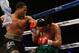 Apr 19, 2014; Washington, DC, USA; Shawn Porter (black gloves and Paulie Malignaggi (red gloves) in action during their bout at DC Armory. Mandatory Credit: Geoff Burke-USA TODAY Sports