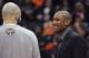 Injured Al Horford talking to Pero Antic before a game.