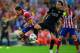 MADRID, SPAIN - APRIL 09: Xavi of Barcelona tackles Koke of Club Atletico de Madrid during the UEFA Champions League Quarter Final second leg match between Club Atletico de Madrid and FC Barcelona at Vicente Calderon Stadium on April 9, 2014 in Madrid, S