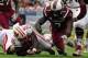 Jan 1, 2014; Orlando, FL, USA; South Carolina Gamecocks defensive end Jadeveon Clowney (7) knocks down Wisconsin Badgers running back Melvin Gordon (25) in the first quarter as the South Carolina Gamecocks face the Wisconsin Badgers in the Capital One Bow