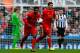 NEWCASTLE-UPON-TYNE, ENGLAND - OCTOBER 19: Daniel Sturridge (L) of Liverpool celebrates his goal with team-mate Luis Suarez during the Barclays Premier League match between Newcastle United and Liverpool at St James' Park on October 19, 2013 in Newcastle-