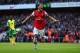 LONDON, ENGLAND - OCTOBER 19: Mesut Oezil of Arsenal celebrates as he scores their second goal during the Barclays Premier League match between Arsenal and Norwich City at Emirates Stadium on October 19, 2013 in London, England. (Photo by Paul Gilham/Ge