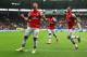 HULL, ENGLAND - APRIL 20: Lukas Podolski (L) of Arsenal celebrates with team mates Olivier Giroud (R) and Bacary Sagna (C) after scoring his sides third goal during the Barclays Premier League match between Hull City and Arsenal at KC Stadium on April 20