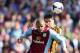 BIRMINGHAM, ENGLAND - MAY 03: Jordan Bowery of Aston Villa is challenged by Alex Bruce of Hull City during the Barclays Premier League match between Aston Villa and Hull City at Villa Park on May 3, 2014 in Birmingham, England. (Photo by Mark Thompson/G