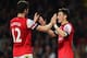 LONDON, ENGLAND - APRIL 28: Mesut Oezil of Arsenal (11) celebrates with Olivier Giroud as he scores their second goal during the Barclays Premier League match between Arsenal and Newcastle United at Emirates Stadium on April 28, 2014 in London, England.