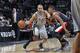 SAN ANTONIO, TX - JANUARY 17: Tony Parker #9 of the San Antonio Spurs drives to the basket against the Portland Trail Blazers on January 17, 2014 at the AT&T Center in San Antonio, Texas. NOTE TO USER: User expressly acknowledges and agrees that, by down