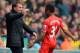 NORWICH, ENGLAND - APRIL 20: Raheem Sterling of Liverpool celebrates scoring the opening goal with Manager Brendan Rodgers of Liverpool during the Barclays Premier League match between Norwich City and Liverpool at Carrow Road on April 20, 2014 in Norwic