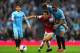 LONDON, ENGLAND - MARCH 29: Mathieu Flamini of Arsenal holds off Fernandinho of Manchester City during the Barclays Premier League match between Arsenal and Manchester City at Emirates Stadium on March 29, 2014 in London, England. (Photo by Shaun Botter