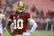 Dec 8, 2013; Landover, MD, USA; Washington Redskins quarterback Robert Griffin III (10) warms up before the game against the Kansas City Chiefs at FedEx Field. Mandatory Credit: Brad Mills-USA TODAY Sports