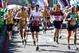 LONDON, ENGLAND - APRIL 12: Runners enjoy the atmosphere as they make their way over Tower Bridge during the Virgin Money London Marathon on April 13, 2014 in London, England. (Photo by Ben Hoskins/Getty Images)