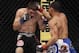 Oct 19, 2013; Houston, TX, USA; John Dodson (red gloves) fights against Darrell Montague (blue gloves) in their flyweight bout during UFC 166 at Toyota Center. Mandatory Credit: Andrew Richardson-USA TODAY Sports